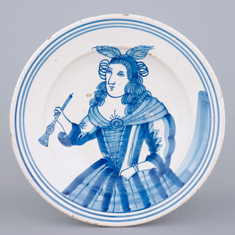 A fine Frisian maiolica charger with the portrait of a lady, Makkum, 17th C.